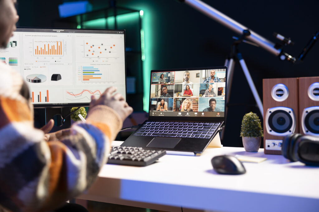 Young adult employee attends a meeting on video conference
